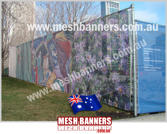 Color fence screens attached to cyclone diamond fence screen on building site